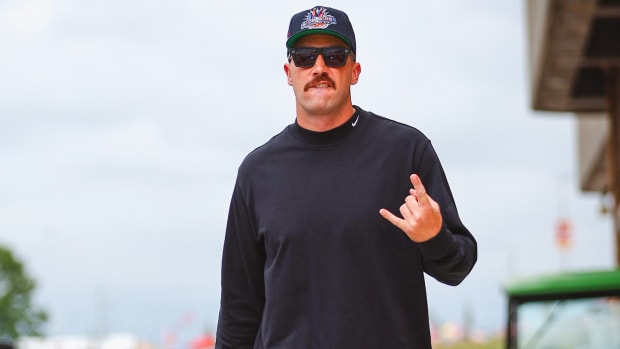 Travis Kelce poses for a picture before an NFL preseason game.